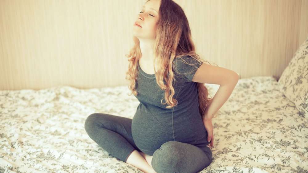 Болит поясница и бедра во время беременности